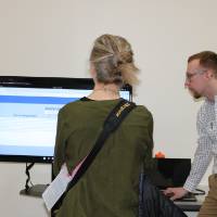 people standing around a senior project